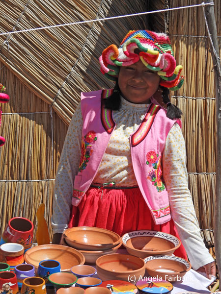 girl selling ceramic bowls