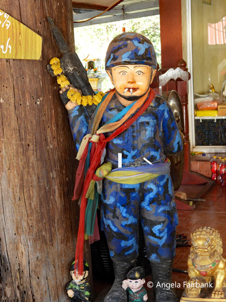army god with two cigarettes in his mouth