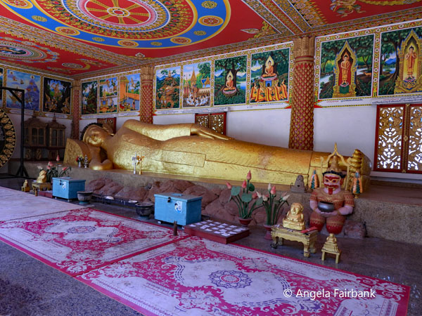 reclining buddha at stupa