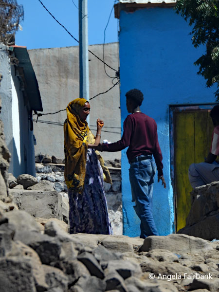 Young woman and man in alley