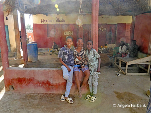 3 boys seated