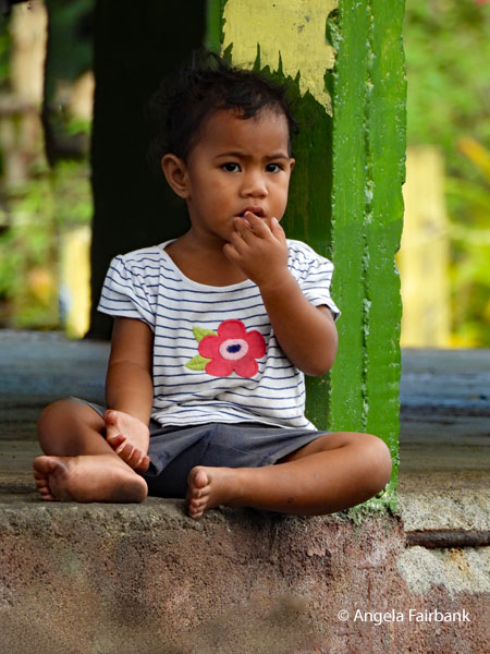 little boy watching cricket game