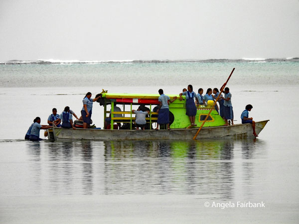 boat with high school students in the rain seen from our lunch place hotel