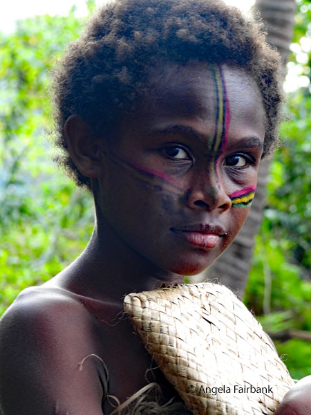 girl holding woven bag