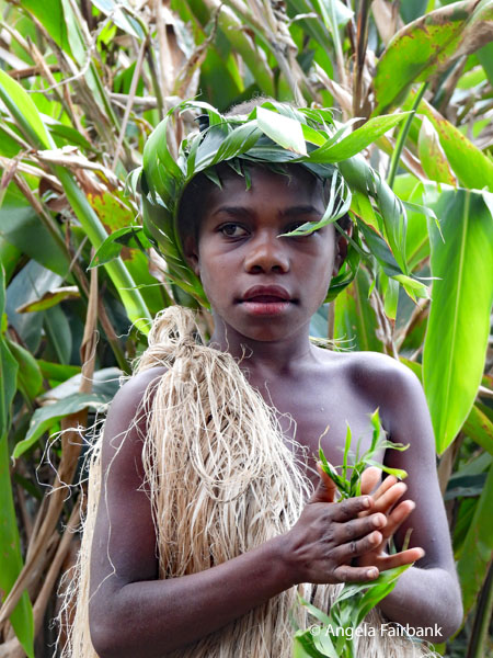 boy holding leaves