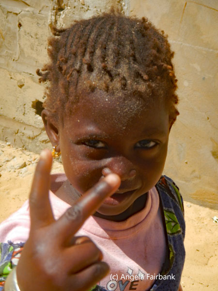 girl holding up 2 fingers