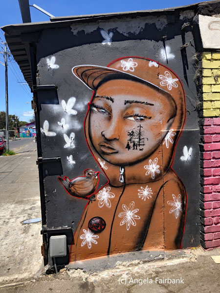 man in brown hoody on wall