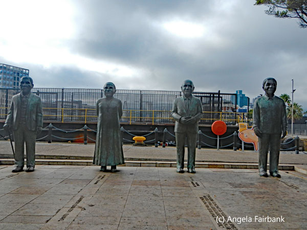 statues of tutu, mandela and two others