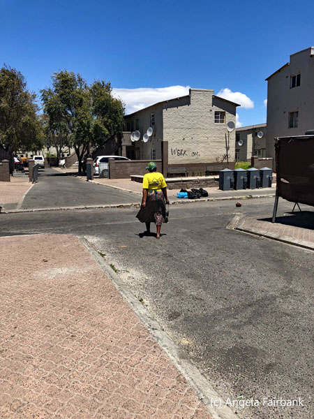 woman walking near apartment building