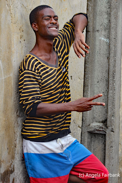 youth in yellow and black striped shirt