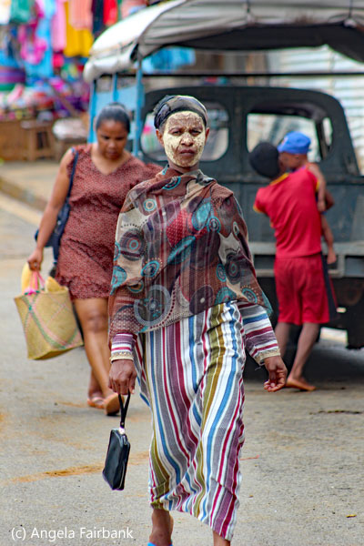 woman walking with face protection
