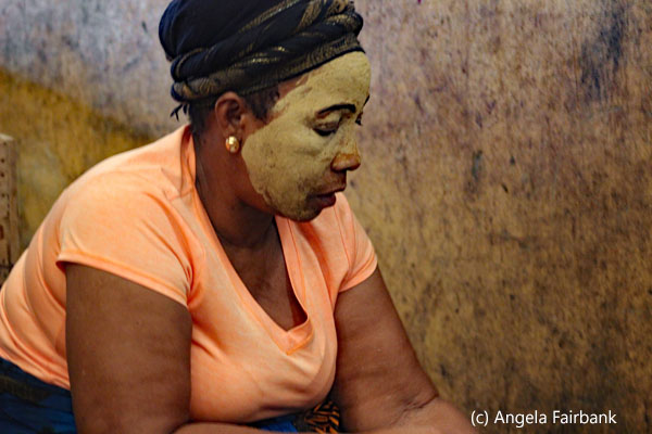 woman in market with face protection