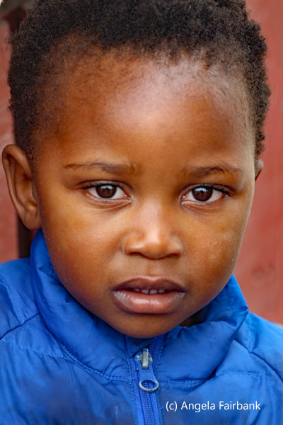 boy in blue jacket