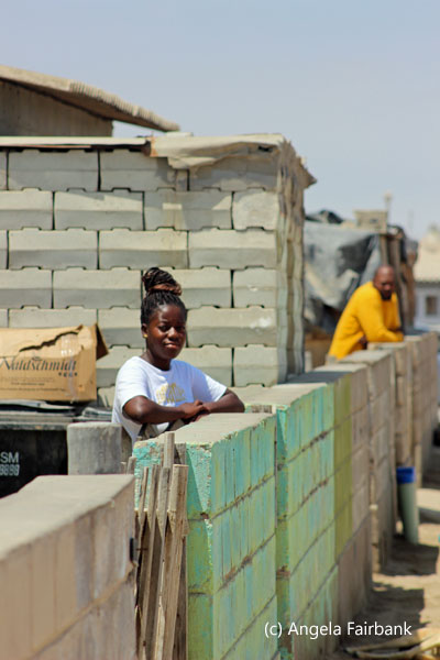 woman and man looking over fence