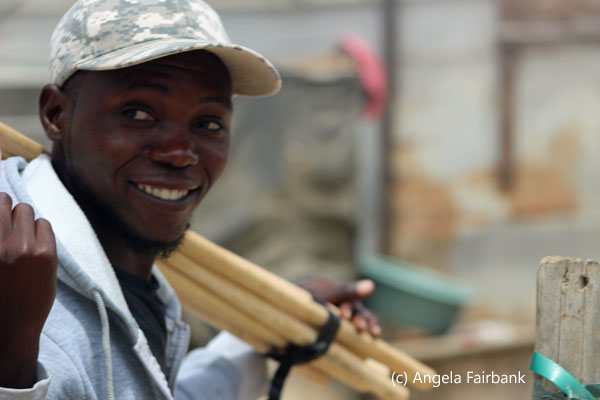smiling youth with wood bars