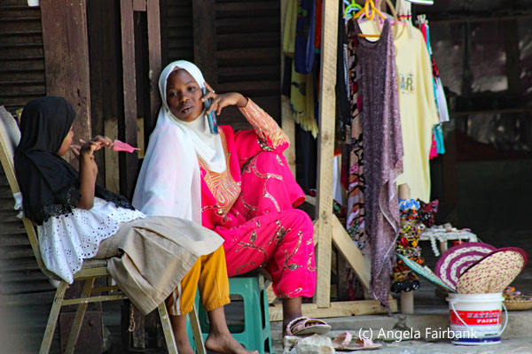 woman on phone and daughter