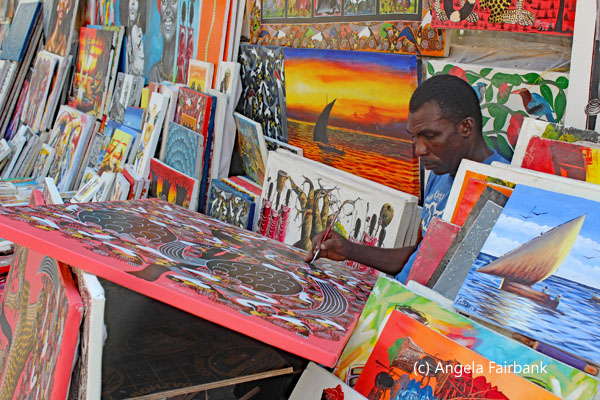 artist with paintings