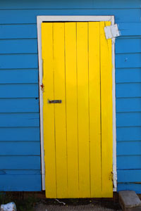yellow door on blue