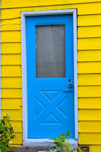 blue door on yellow