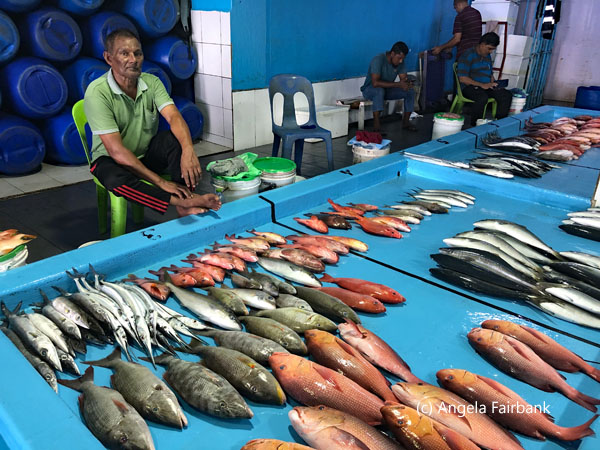 men with fresh fish