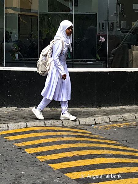 school girl about to cross the street